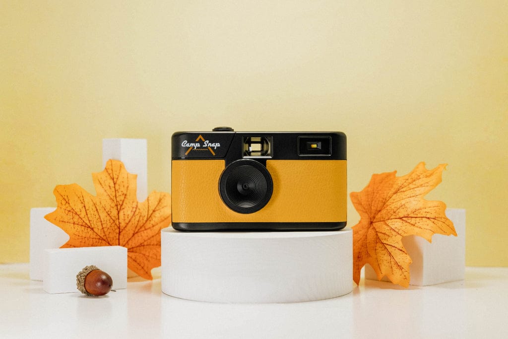 Camp Snap screen-free digital camera with durable design, long-lasting battery, vintage look, and easy memory storage.