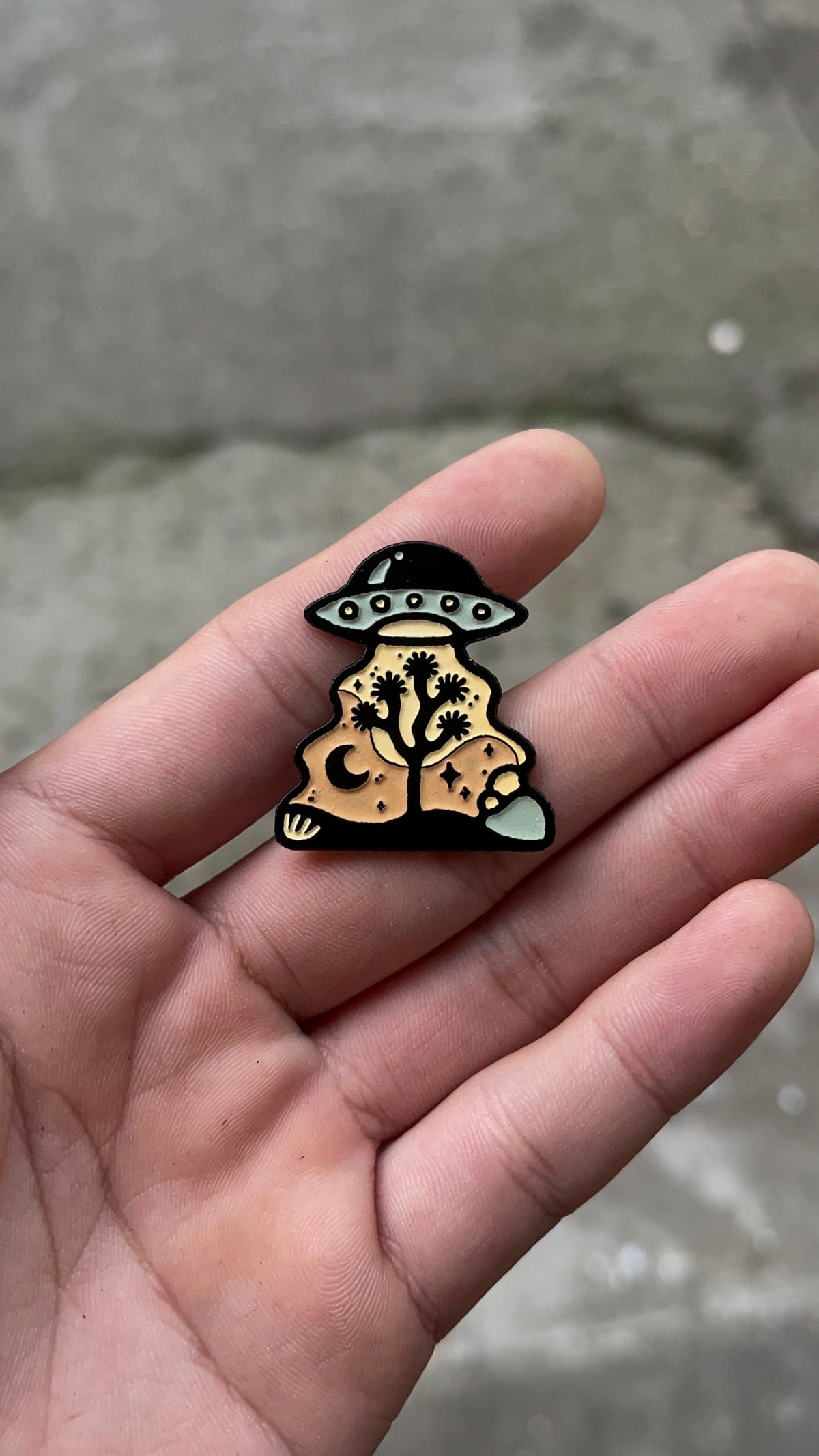 Amber Morgan UFO Over Joshua Tree Glow In The Dark Enamel Pin available in Joshua Tree at JT Trading Post