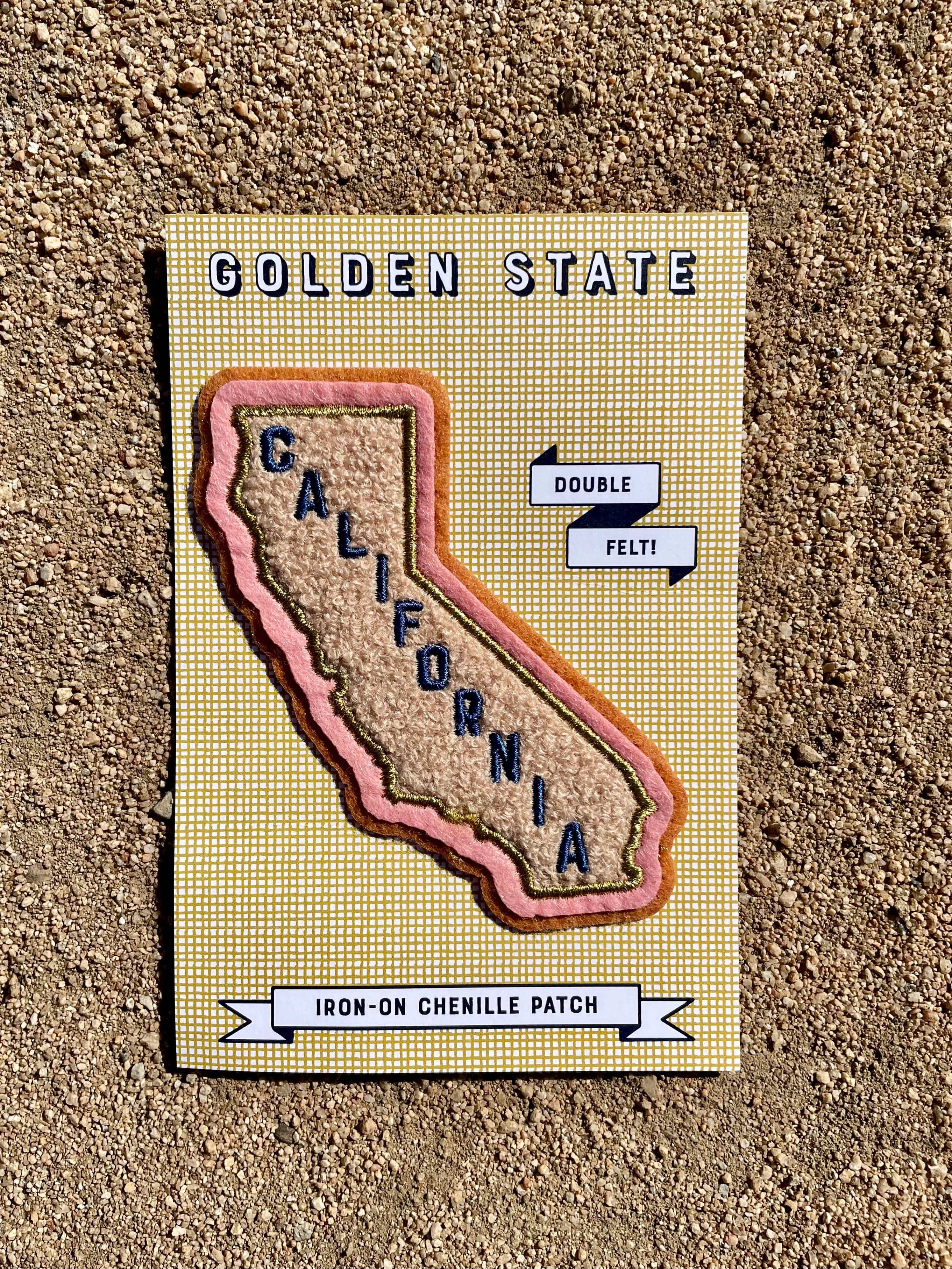 A chenille patch depicting a stylized map of California with 'Golden State' text, designed on a double felt base with gold metallic embroidered details.