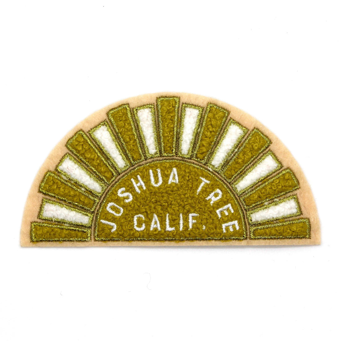 A chenille patch depicting a stylized yellow and white sun with 'Joshua Tree Calif.' text, designed on a pink felt base with gold metallic embroidered details.